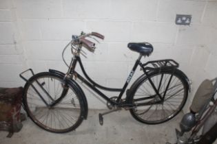 A vintage Atlas Royale ladies cycle with carrier a