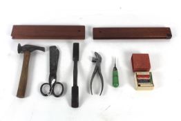 A box of tools to include two dowel troughs, a dou