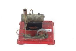 A Mamod tin plate steam engine with burner and pul