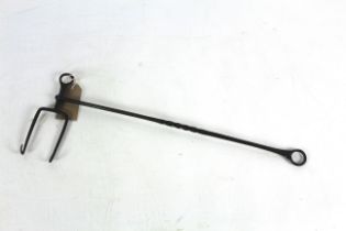 A rare 18th Century hand held steel adjustable hea