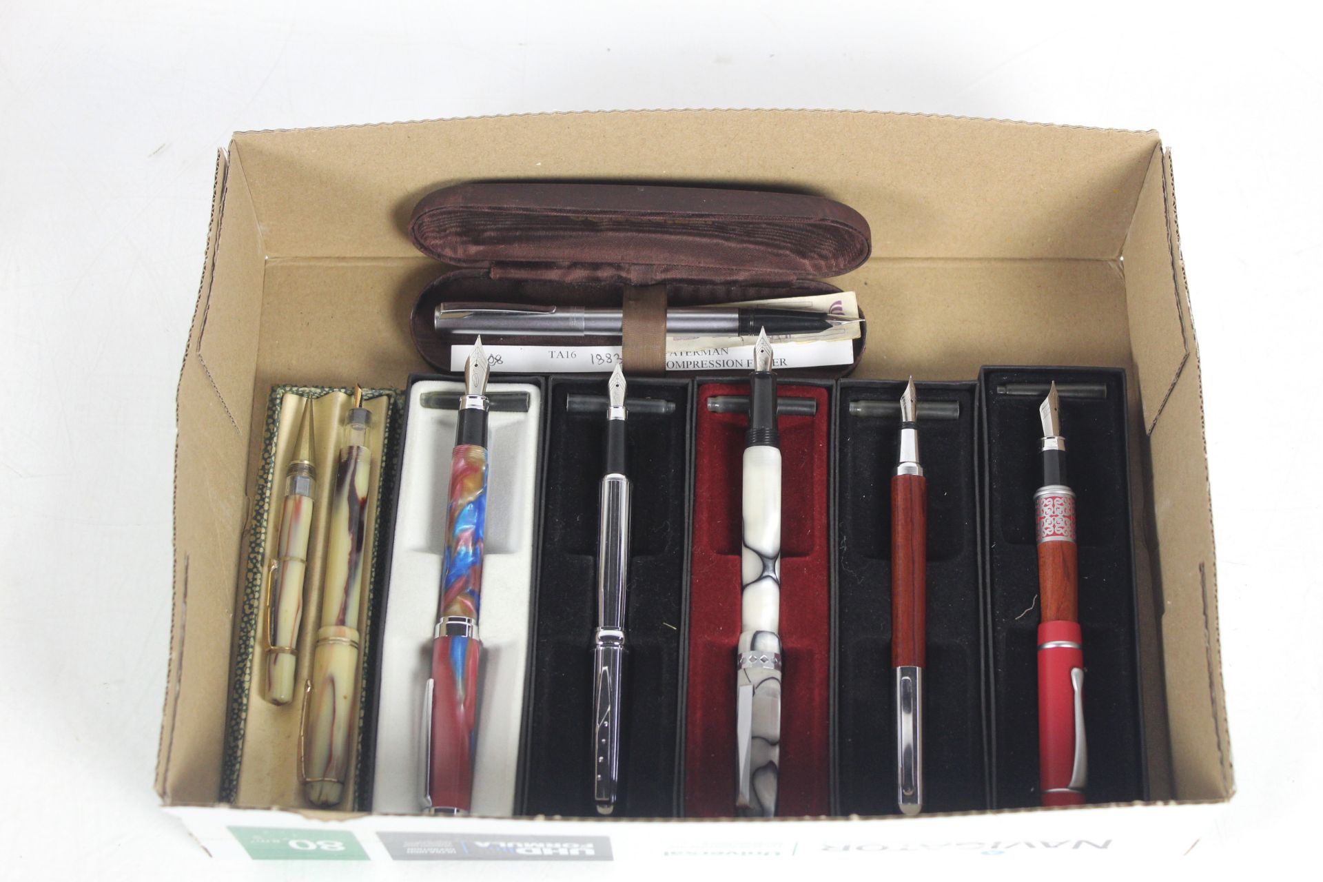 A box containing seven various boxed fountain pens