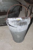 A bucket wall planter with swing handle