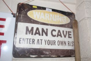 A tin plated "Warning, Man Cave Enter At Your Own Risk" sign AF