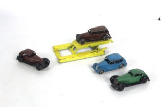 Four models of saloon cars and one vehicle lift