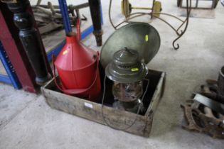 An oil can, a vintage heater and a lamp in an R.W.