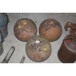 Three vintage terracotta balls