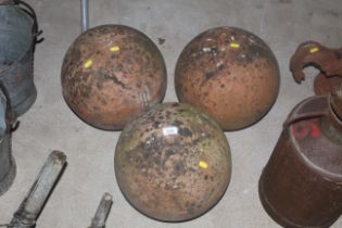 Three vintage terracotta balls