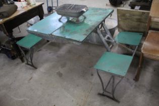 A folding picnic table with benches