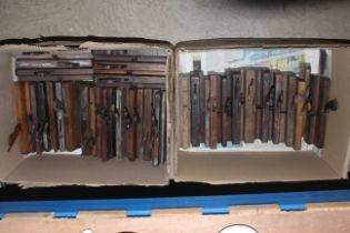 Two boxes of wooden moulding planes