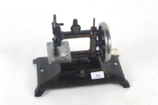 A Victorian hand operated sewing machine entwined