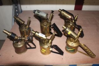 Six various blow lamps, brass blow lamps of variou