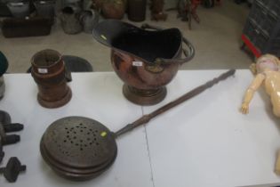 A copper coal hod and a copper warming pan with pierced lid and turned wooden handle