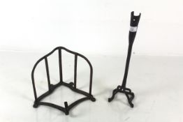 An iron saddle rack and branding iron