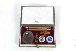 A case Oriental calligraphy writing set