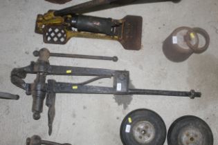 A vintage cast iron leg vice