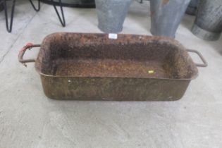 A cast iron twin handled trough