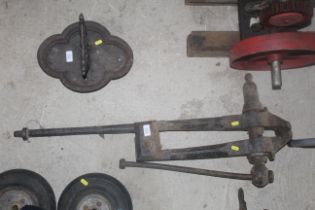 A vintage cast iron leg vice