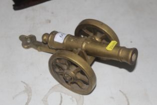 A large brass model of a cannon