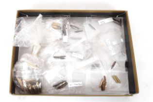 A box of various pen nibs