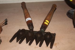 A set of wooden handled hedging shears with multip