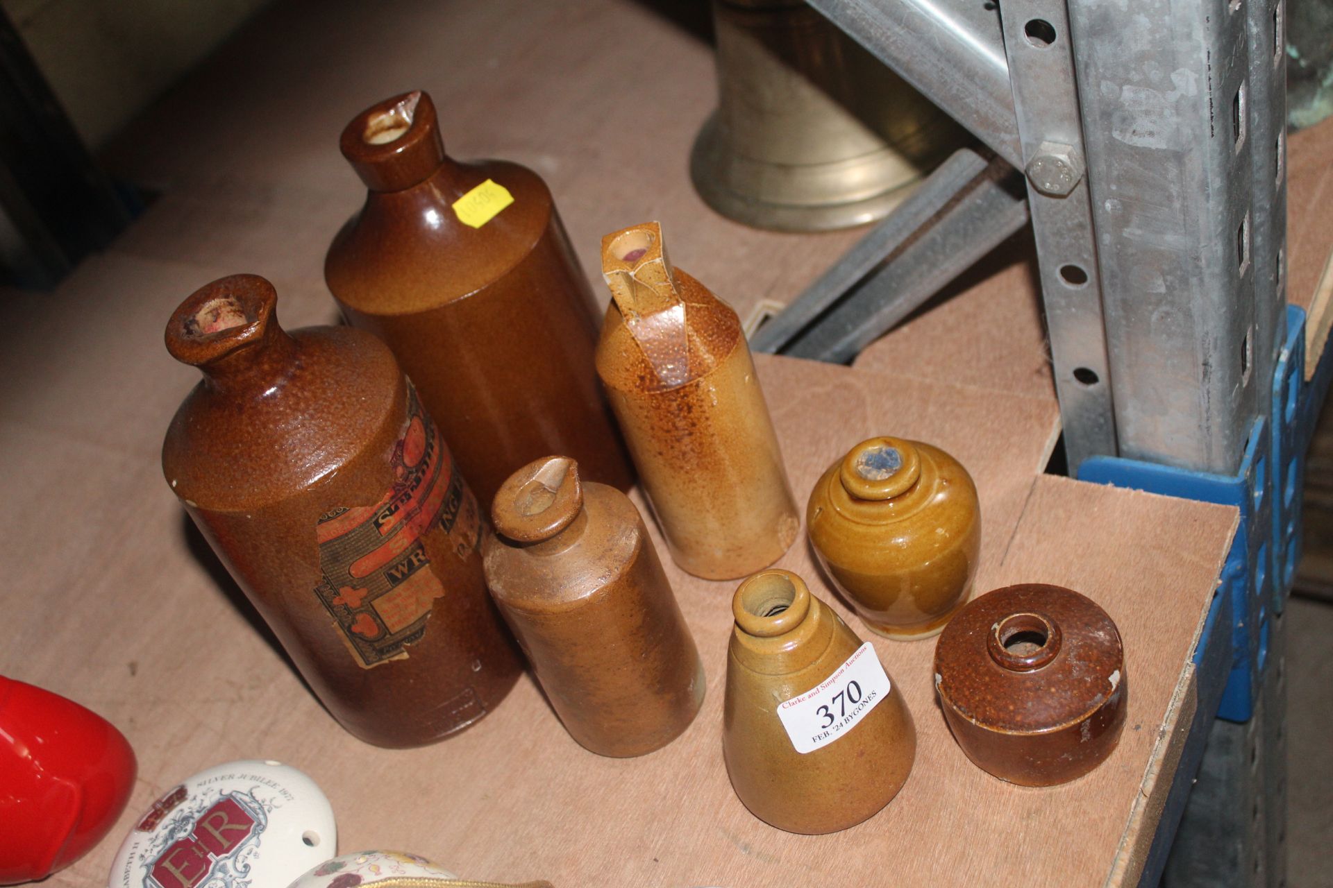 A quantity of stoneware ink bottles etc.