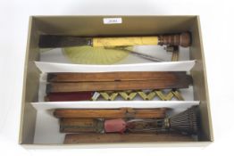 A box containing various brass mounted folding wooden measures, long handled scraper, drawing