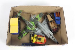 A box containing various model toys including Dink