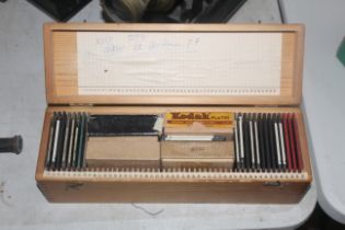 A box containing a collection of Magic Lantern slides including slides including Canada Lecture