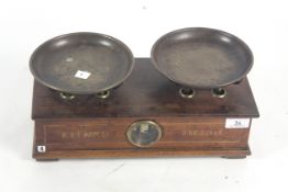 A wooden and brass W & T Avery Ltd. of Birmingham set of balance counters scales