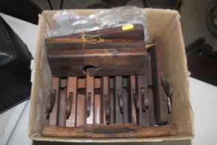 A box of various sized moulding planes