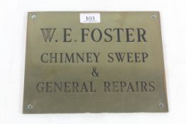 A brass sign for "W. E. Foster Chimney Sweep and G