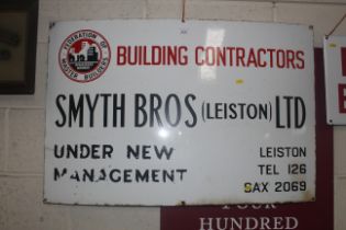 An enamel sign for "Smyth Bros. Leiston Ltd. Build