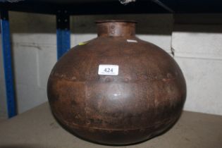 A round metal water pot