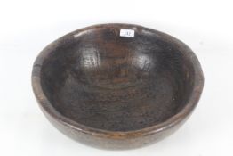 A large 18th Century English turned wooden bowl