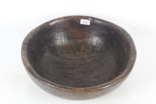 A large 18th Century English turned wooden bowl
