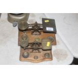 Two small sets of brass postal scales with a small