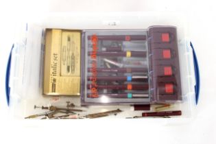 A box containing a Rotring drawing pen set, an Italic set, drawing dividers etc.