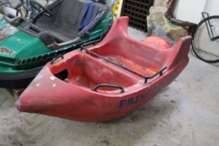 A red rocket ship fairground cart