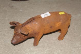 A small cast iron figure of a pig