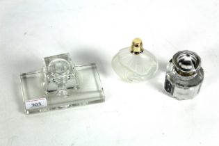 Two glass inkwells and a scent bottle