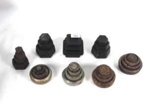 A large quantity of various shaped cast iron scale weights