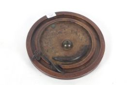 An unusual 19th Century circular wooden bagatelle