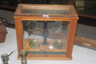 A cased set of laboratory scales