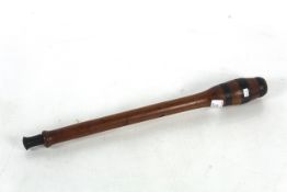 A long handled corking tool