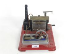 A Mamod model steam engine with burner and pulley