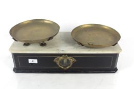 A small box base wooden and brass counter scale with marble top to base