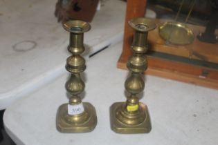 A pair of brass candlesticks