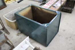 A large green painted water tank, approx. 35" L x 23¾" D x 24" H