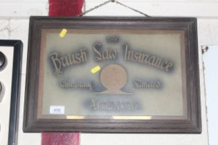 A framed "British Saw Insurance Co. Ltd." advertis