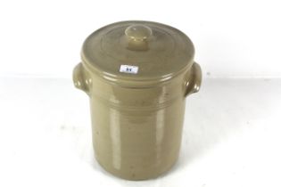 A stoneware pot with lid